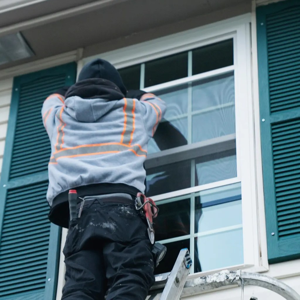 Knoxville Window Company | Replacement Windows & Installation Window installer retrofitting a window