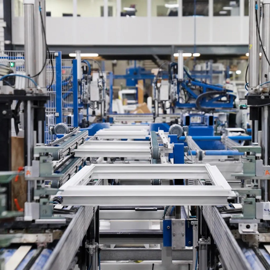 Knoxville Window Company | Replacement Windows & Installation Window Being Pushed Down in Window Manufacturer